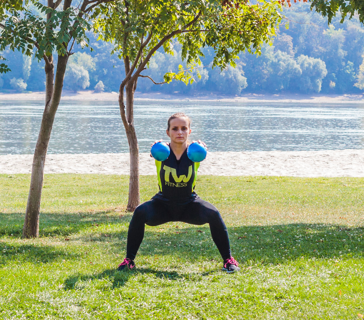 Two-Medicine Ball Sumo Squat frame #2