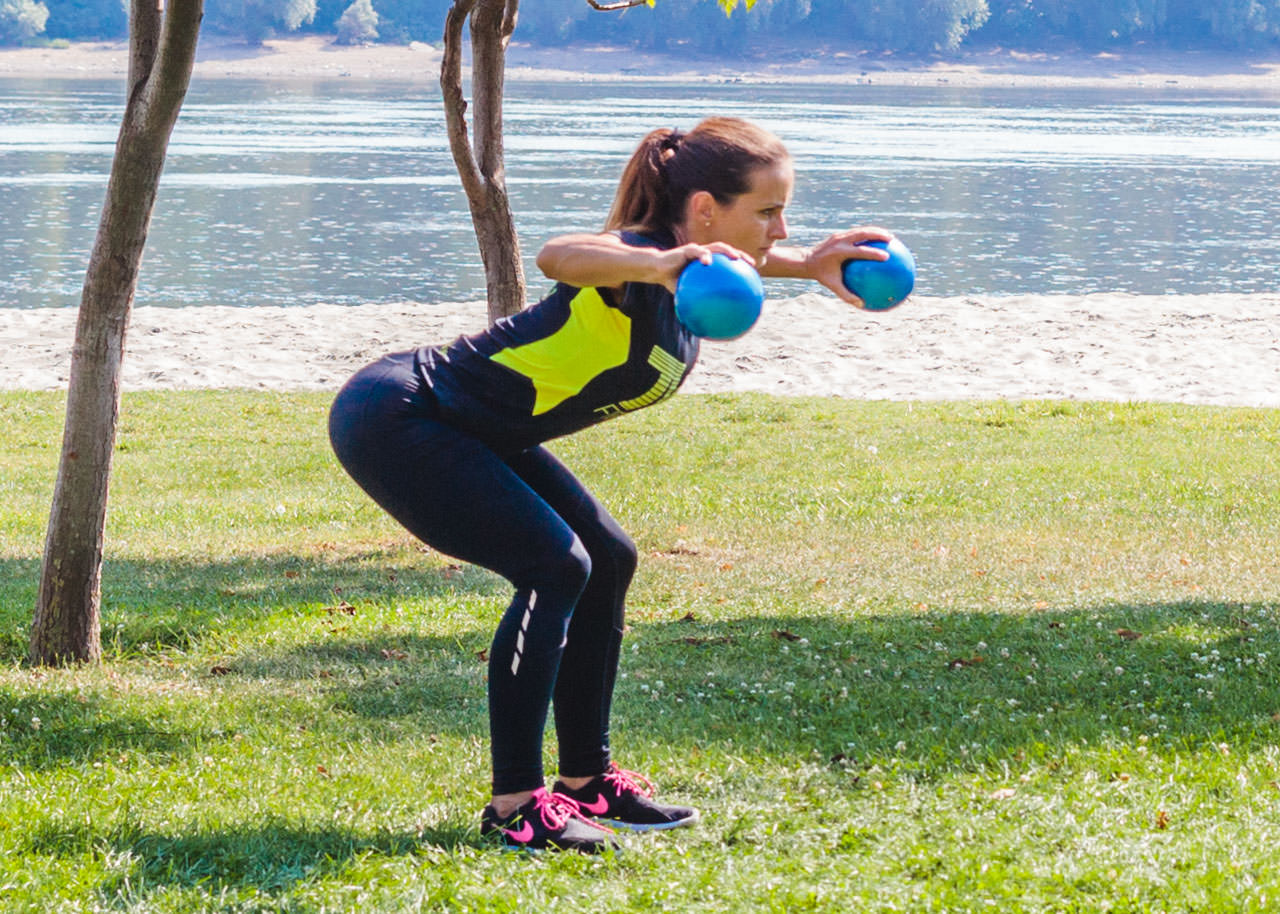 Medicine Ball Half Squat Lateral Raise frame #2