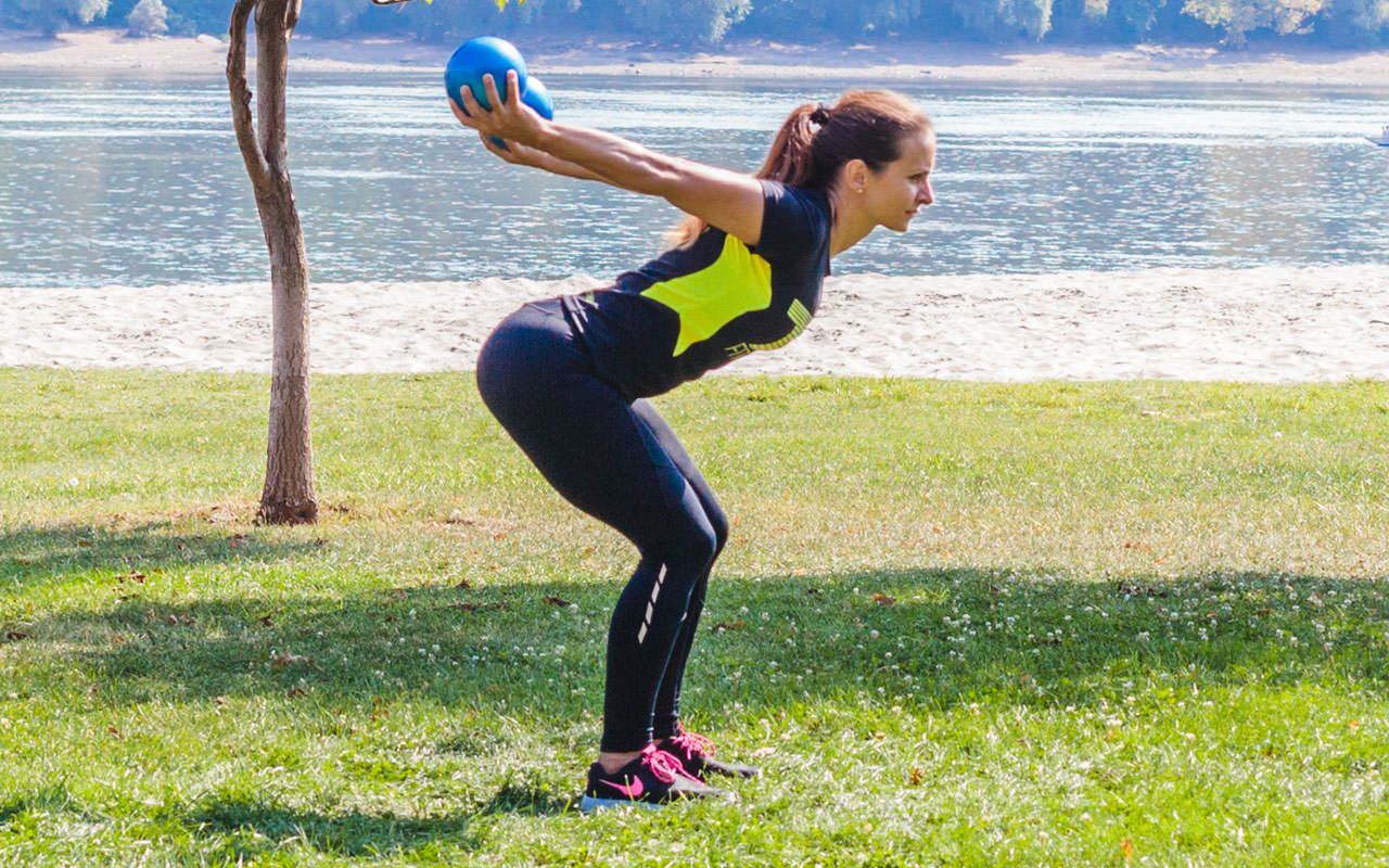 Bent Over Two-Medicine Ball Triceps Extension frame #2