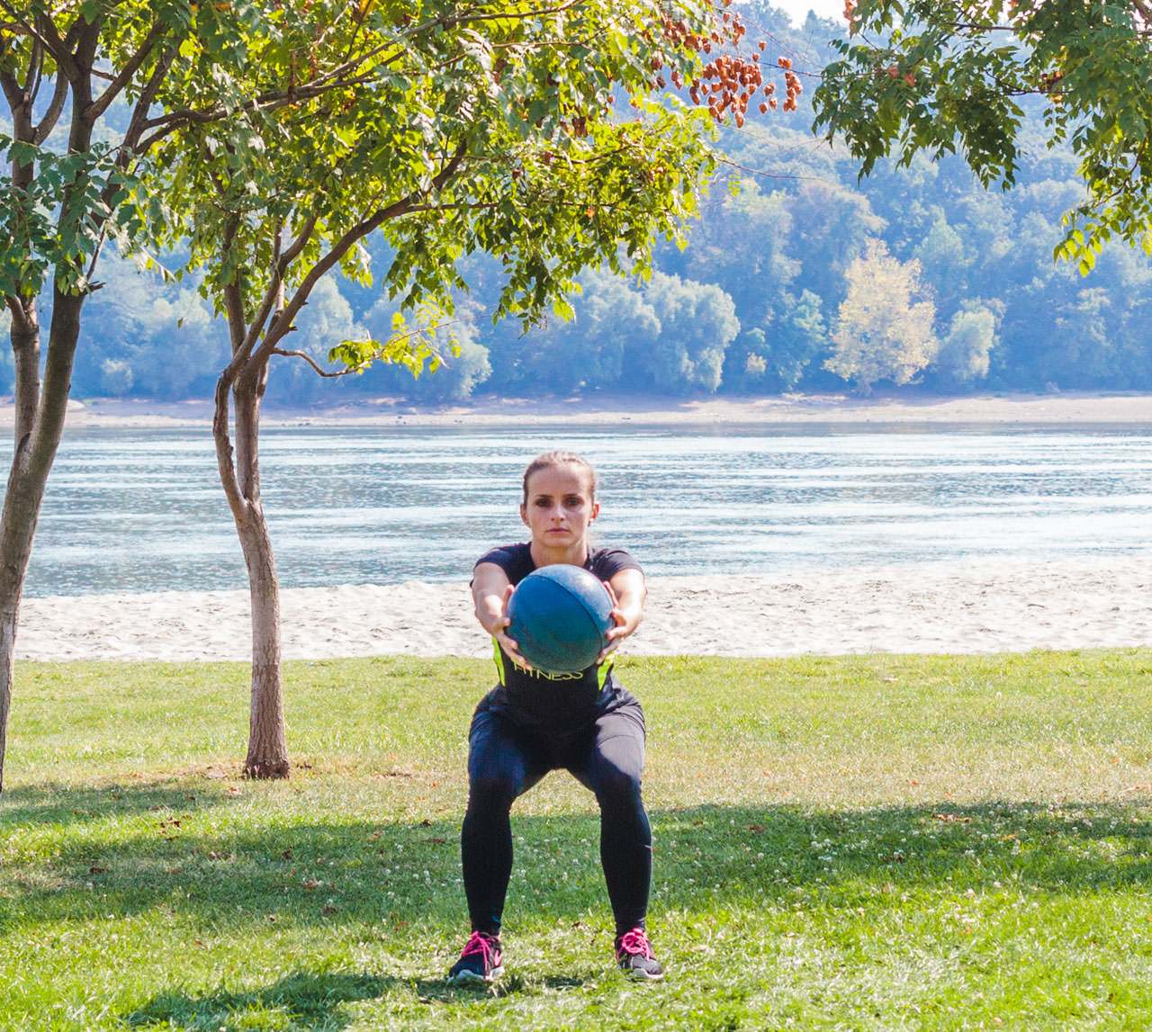 Medicine Ball Squat with Torso Rotation frame #2