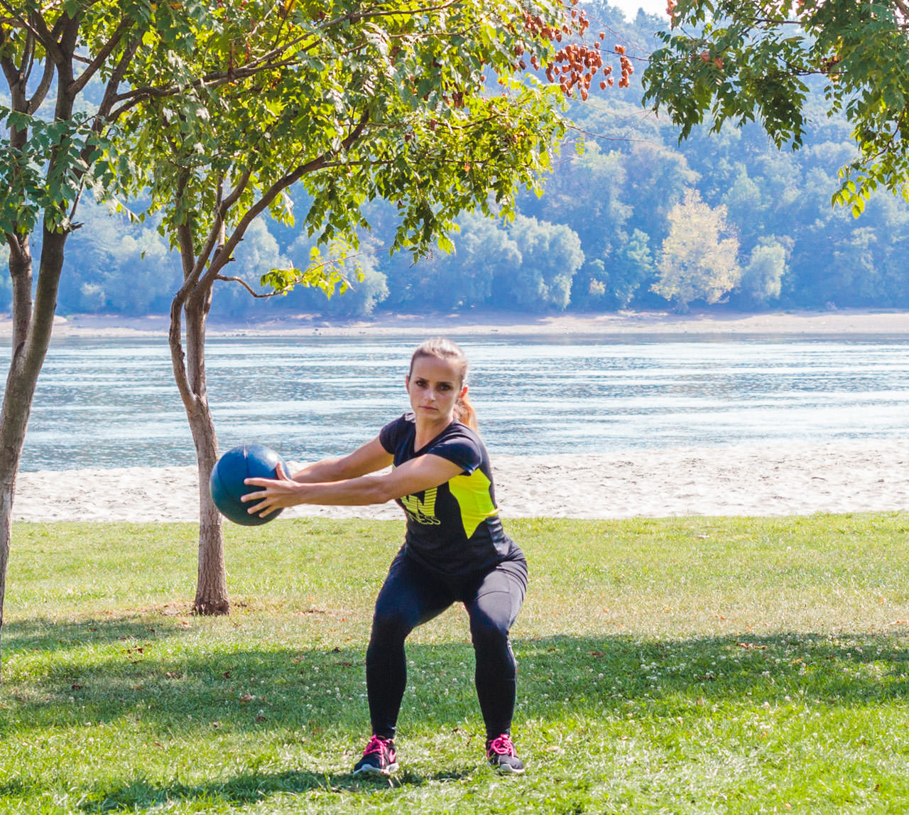 Medicine Ball Squat with Torso Rotation frame #3