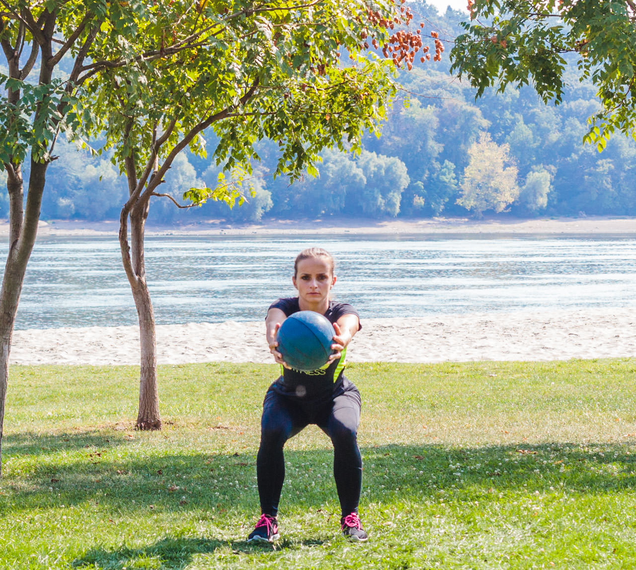 Medicine Ball Squat with Torso Rotation frame #4