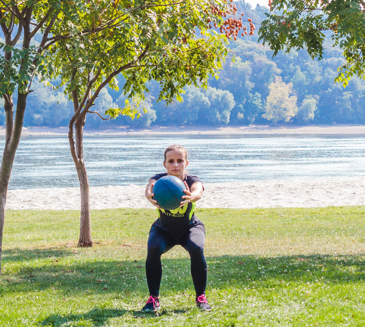 Medicine Ball Squat with Torso Rotation frame #6