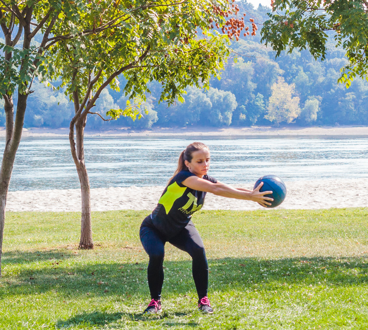 Medicine Ball Squat with Torso Rotation frame #7