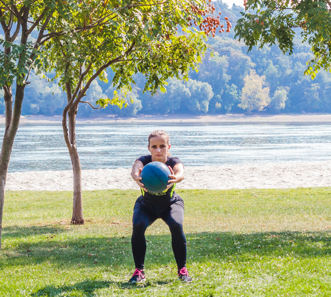 Medicine Ball Squat with Torso Rotation frame #8