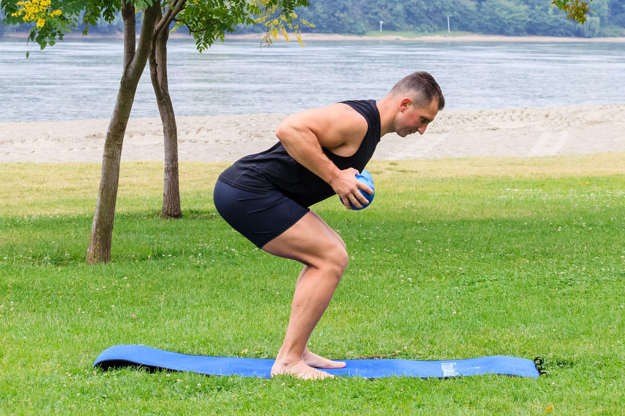 Bent Over Two-Medicine Ball Triceps Extension frame #1