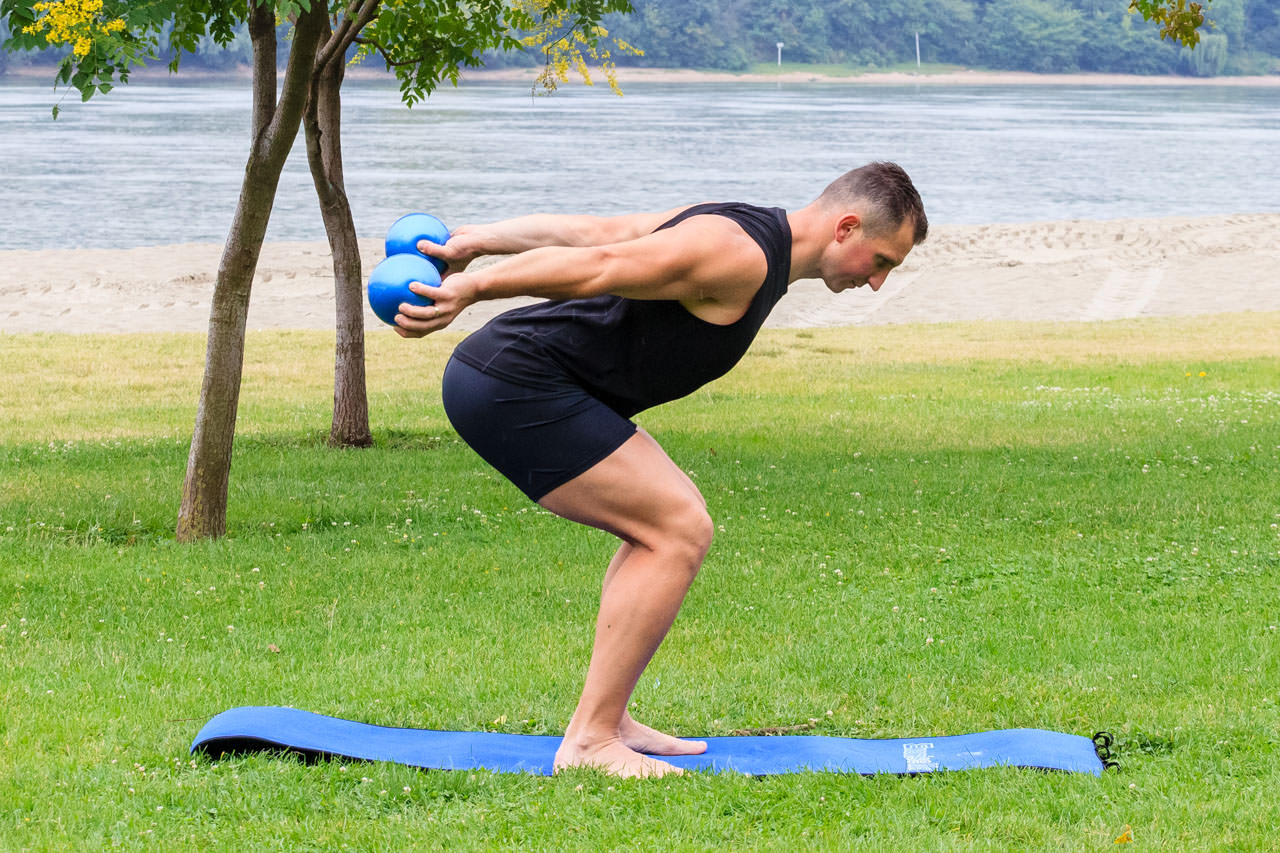 Bent Over Two-Medicine Ball Triceps Extension frame #2